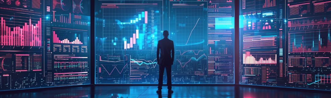 Mann vor Bildschrimen